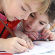 two children doing homework together